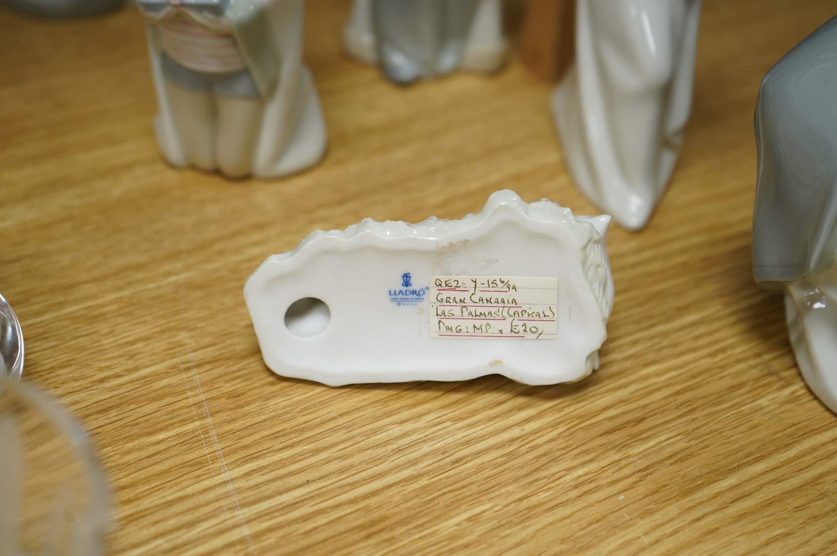 A group of Lladro figures Lord & Lady and a Chancellor, 3 Kings, Joseph with Staff and a recumbent child (8)